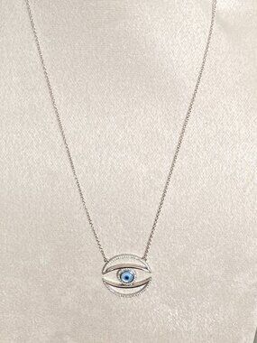 Sterling Silver evil eye pendant necklace adorned with Crystal